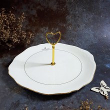 Cake stand men bóng vành chạm họa tiết nổi, viền vàng sang trọng của Valentino. Dùng bày bánh, trái cây hoặc các món khai vị rất sang.